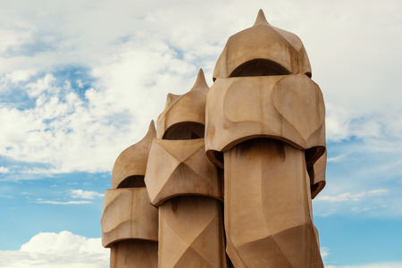 BARCELONA, SPAIN - MAY 31, 2014: Chimneys on rooftop of Gaudi's masterpiece Casa Batlo. The building that is now Casa Batllo was built in 1877 by Antoni Gaudi, commissioned by Lluis Sala Sanchez.のeditorial素材