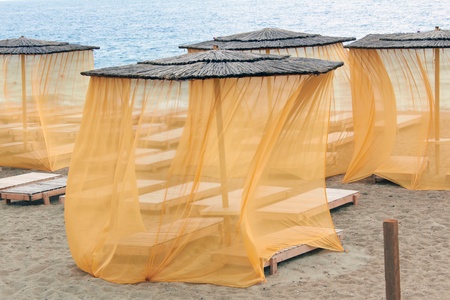 straw awning on coast of the sea の写真素材