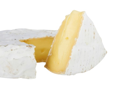 Round soft brie cheese section cut isolated on white background の写真素材