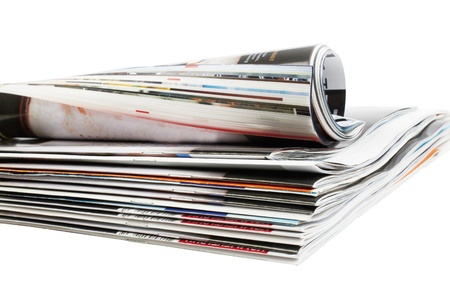 Various stacked and rolled magazines の写真素材