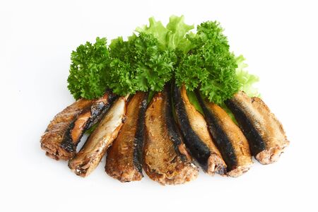 Smoked sprats in oil on white backgroundの写真素材