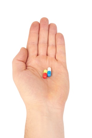 pills in hand isolated on white の写真素材