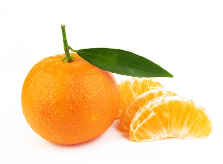 Ripe tangerine with slices on white backgroundの写真素材
