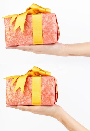  hand holding gift box, on white backgroundの写真素材