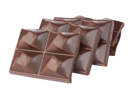 Stacked dark chocolate isolated on a whiteの写真素材
