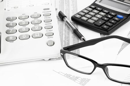 calculator and pen on a business background の写真素材