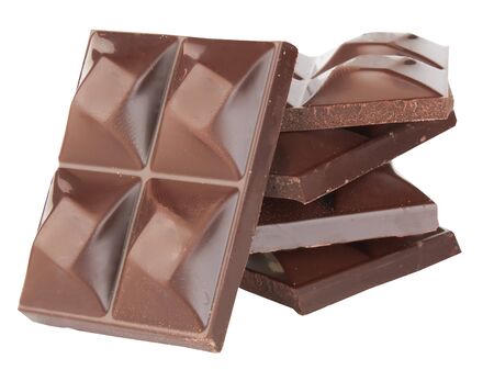 Stacked dark chocolate isolated on a white の写真素材