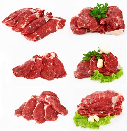 the piece of raw fillet steak with mushroom salad and garlic isolated on white background. の写真素材