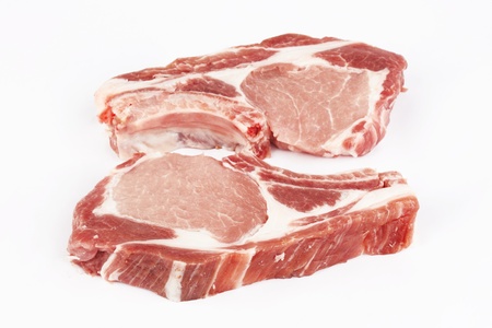 meat raw pork cutlet on a white background の写真素材