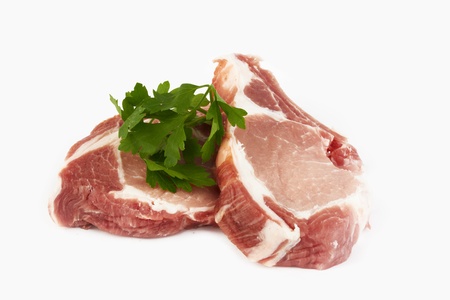 meat raw pork cutlet on a white background の写真素材