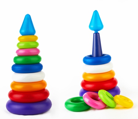 Fallen toy pyramid on whiteの写真素材
