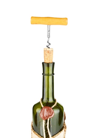  bottle with a cork and corkscrew which is screwed into the cork isolatedの写真素材