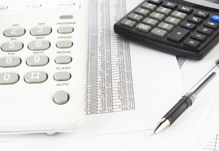 calculator and pen on a business background の写真素材