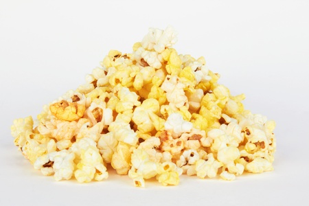 Salted popcorn grains on the white background の写真素材