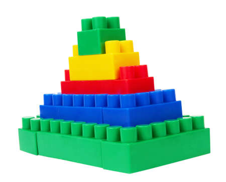 plastic building blocks pyramid on a white background の写真素材