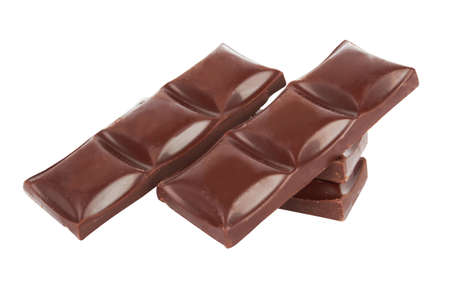 chocolate pieces isolated on a white background の写真素材