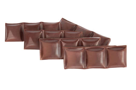 chocolate pieces isolated on a white background の写真素材