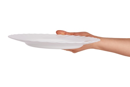 white kitchen plate on woman hand on white backgroundの写真素材