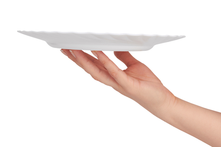 white kitchen plate on woman hand on white background の写真素材