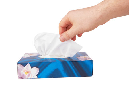 Tissue box with hand isolated on a white background の写真素材