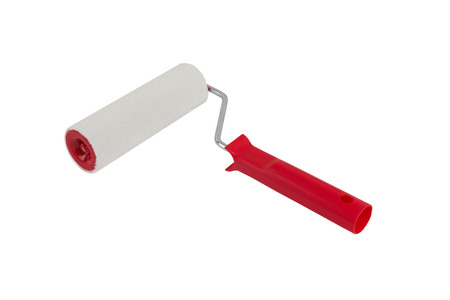 red paint roller isolated on a white backgroundの写真素材