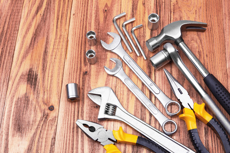 Different kinds of tools on wooden  backgroundの写真素材