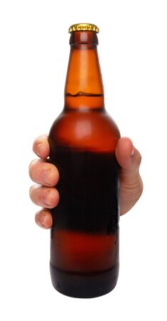 hand holding a beer bottle without label isolated on white backgroundの写真素材