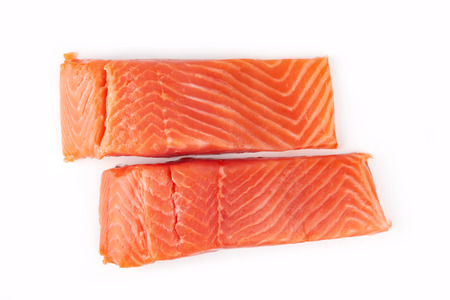 Sliced raw salmon isolated on white backgroundの写真素材