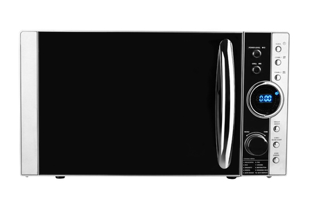 closed microwave made of shiny metal isolated on a white backgroundの写真素材