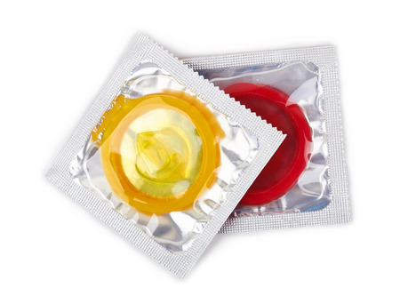 Colorful condoms isolated on white backgroundの写真素材