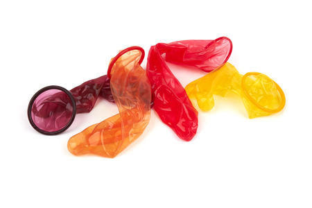 Colorful condoms isolated on white backgroundの写真素材