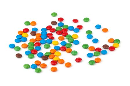 colorful chocolate buttons on a white backgroundの写真素材