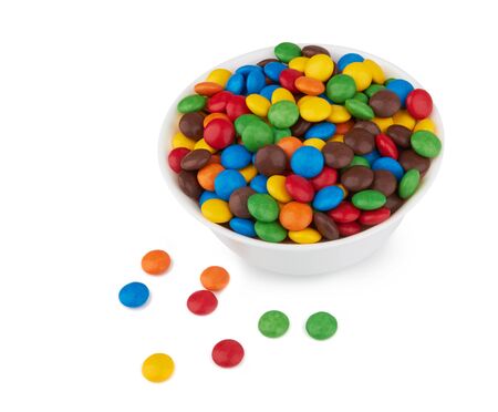 colorful chocolate buttons isolated on white backgroundの写真素材