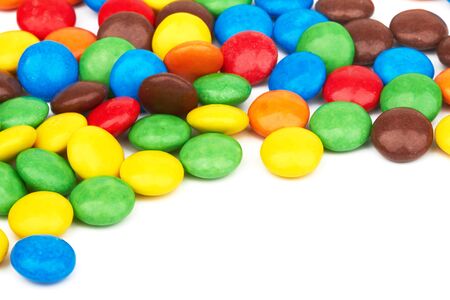 colorful chocolate buttons on a white backgroundの写真素材