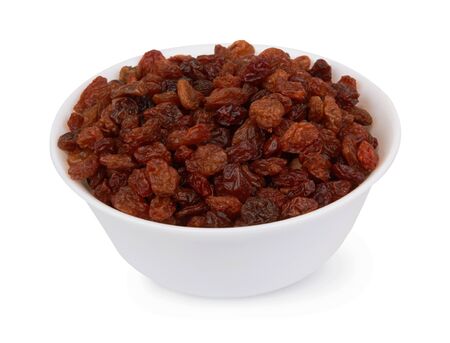 Raisins in bowl isolated on a white backgroundの写真素材