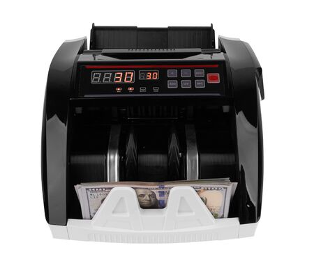 Electronic money counter withhundred dollars banknotes on whiteの写真素材
