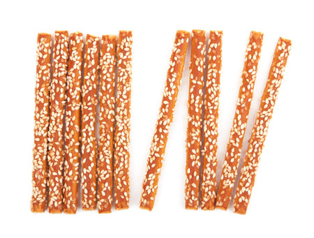 Pretzel sticks coated sesame isolated on white background