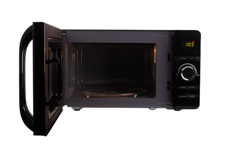 open microwave oven isolated on a white backgroundの写真素材
