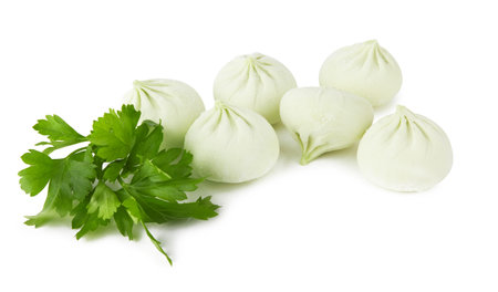 Frozen green khinkali isolated on white backgroundの写真素材