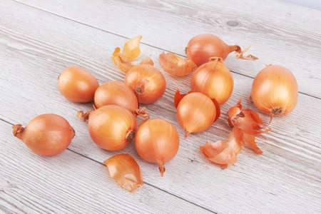 Pile of walnuts on a wooden surfaceの写真素材