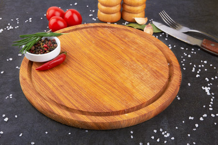 cutting board on a stone black surfaceの写真素材