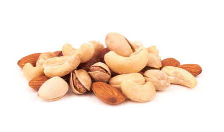 Heap of mixed nuts isolated on white backgroundの写真素材