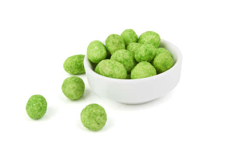 Wasabi coated peanuts isolated on white backgroundの写真素材
