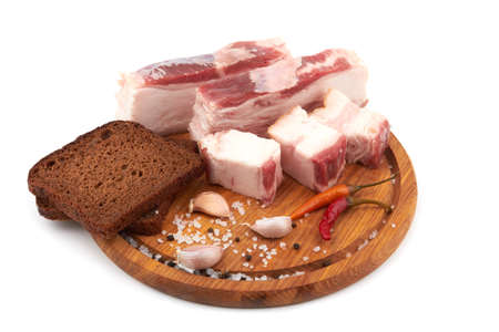 Raw pork belly with streaks of fat isolated on white backgroundの写真素材
