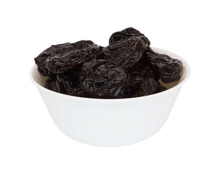 Heap of prunes isolated on white backgroundの写真素材