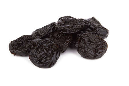 Heap of prunes isolated on white backgroundの写真素材