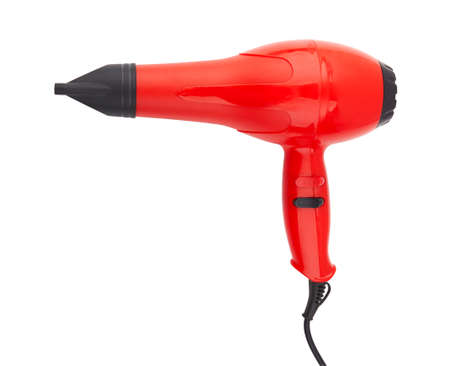 Red hair dryer isolated on a white backgroundの写真素材