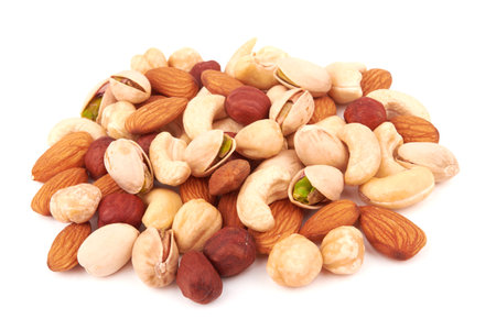 Heap of mixed nuts isolated on white backgroundの写真素材