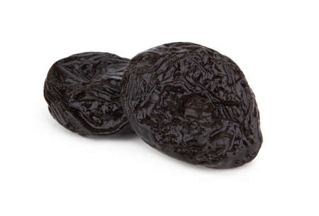 Heap of prunes isolated on white backgroundの写真素材