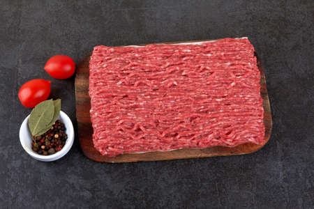 Fresh pork and beef minced meat on a blackの写真素材